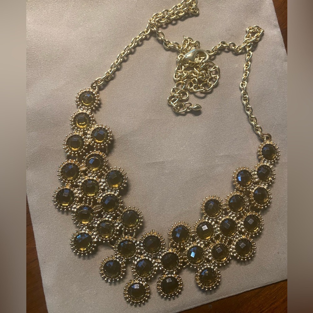 Beautiful gold necklace with clusters of amber stones